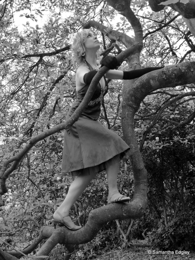 Kate climbing a tree